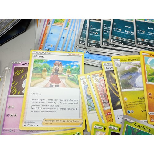 2022 - A large collection of Pokémon cards in collectors tin including holographic