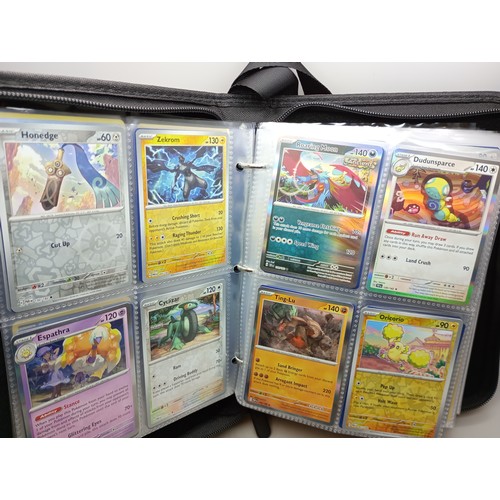 2023 - A Pokémon binder full of holographic cards, approximately 430