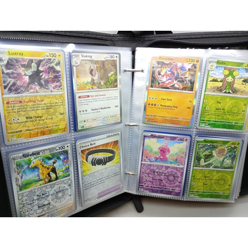 2023 - A Pokémon binder full of holographic cards, approximately 430