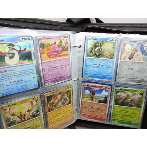 2023 - A Pokémon binder full of holographic cards, approximately 430