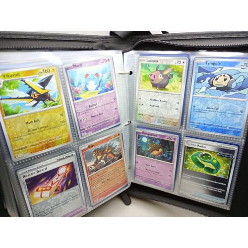 2023 - A Pokémon binder full of holographic cards, approximately 430