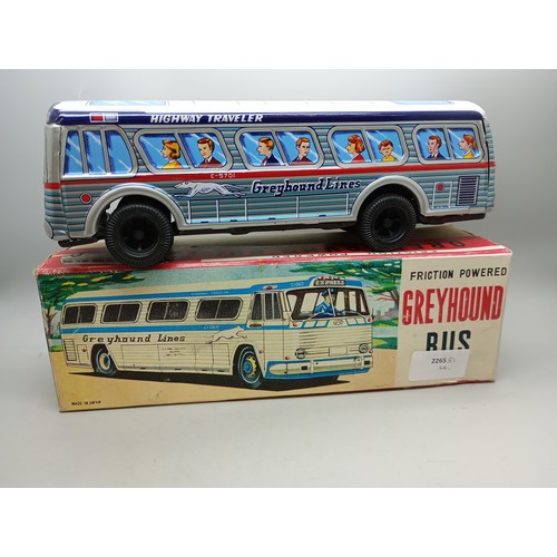 2033 - A Japan made friction powered tin-plate Greyhound coach, in original box, 25cm