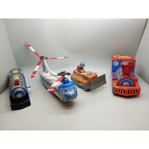 2040 - Four tin-plate vehicles, including Pan Am Skyway Helicopter, all Japan made, Pan Am 22cm