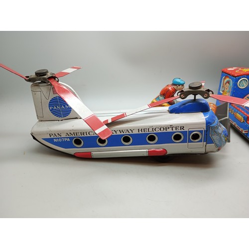 2040 - Four tin-plate vehicles, including Pan Am Skyway Helicopter, all Japan made, Pan Am 22cm