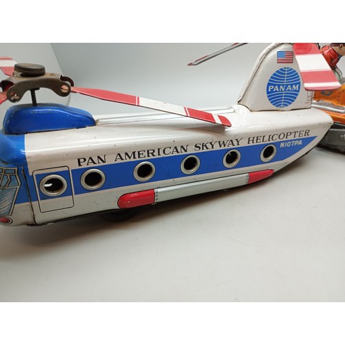 2040 - Four tin-plate vehicles, including Pan Am Skyway Helicopter, all Japan made, Pan Am 22cm