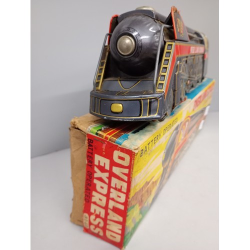 2057 - A tin-plate battery operated toy locomotive Overland Express, non stop running, sounding whistle, by... 