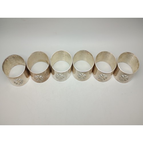 A set of Maltese cross napkin rings