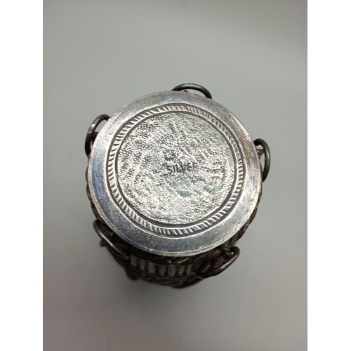 7270 - An Eastern white metal fretwork pot in the form of a drum, marked silver to lid, 187g, 10cm