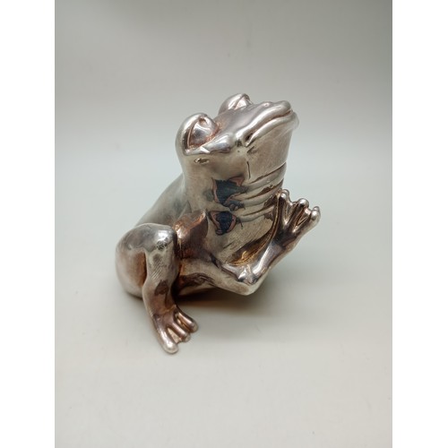 7271 - A silver covered model of a frog, stamped 925, weighted, 150g total, 7.5cm tall