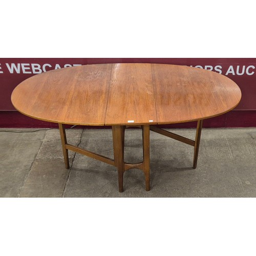 34 - A Nathan teak drop leaf table