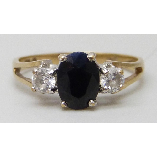 7002 - A 9ct gold, sapphire and white stone ring, 1.7g, K