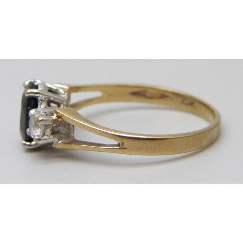 7002 - A 9ct gold, sapphire and white stone ring, 1.7g, K