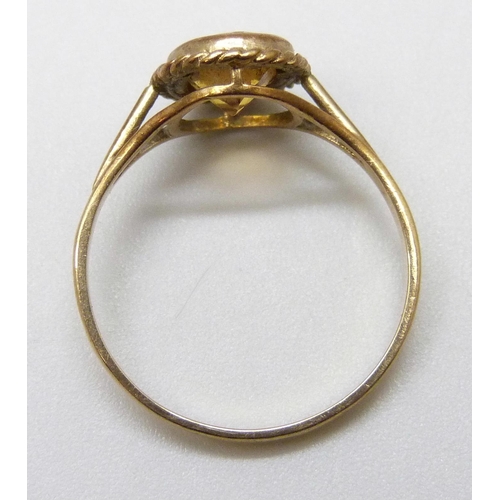 7006 - A 9ct gold ring set with a yellow stone, 1.6g, N/O