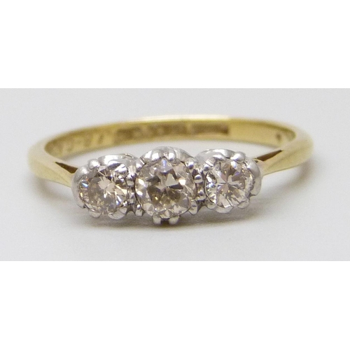 7017 - An 18ct gold and platinum diamond set trilogy ring, wit inscription dated 1939, 2.1g, L