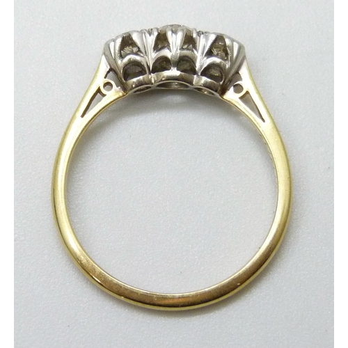 7017 - An 18ct gold and platinum diamond set trilogy ring, wit inscription dated 1939, 2.1g, L