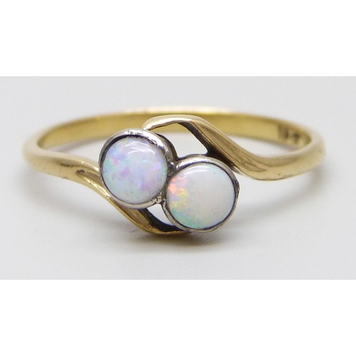 7020 - A yellow metal opal crossover ring, stamped 18ct, 2.2g, P