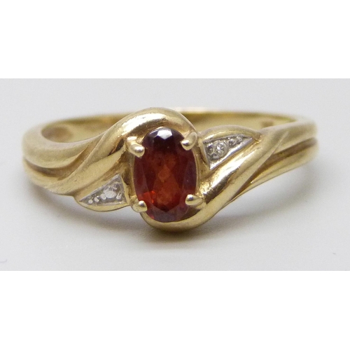 7034A - A 9ct gold garnet set ring, 2.6g, P