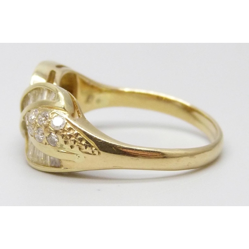 7042 - An 18ct gold diamond set crossover ring, 5.9g, T/U