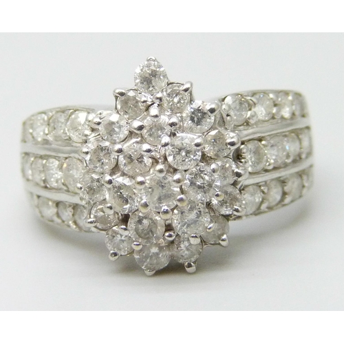 7046 - A 9ct white gold diamond cluster ring, 5.7g, S