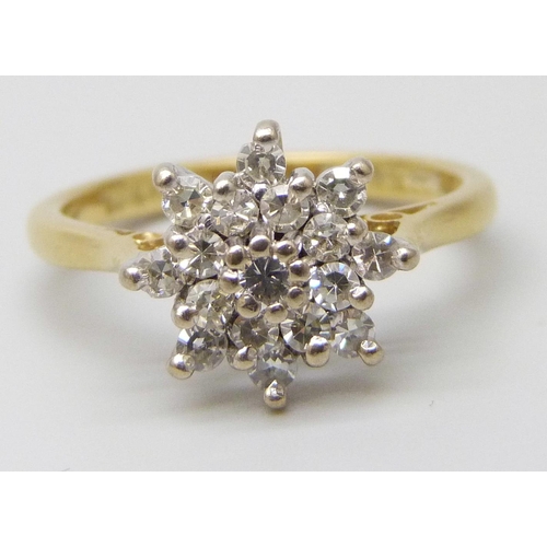 7052 - An 18ct gold diamond cluster ring, 3.9g, M/N