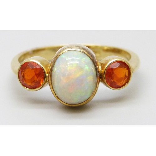 7058 - An 18ct gold opal set ring, 3.4g, N