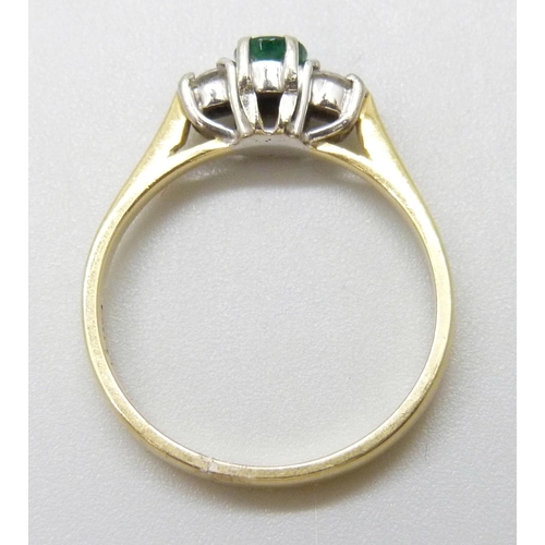 7059 - An 18ct gold, diamond and emerald ring, 2.9g, M