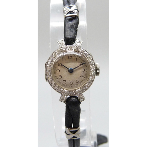 7189 - A lady's platinum and diamond cocktail wristwatch, 19mm including crown