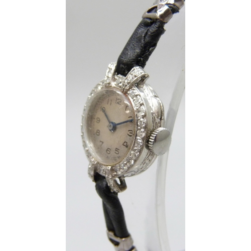 7189 - A lady's platinum and diamond cocktail wristwatch, 19mm including crown