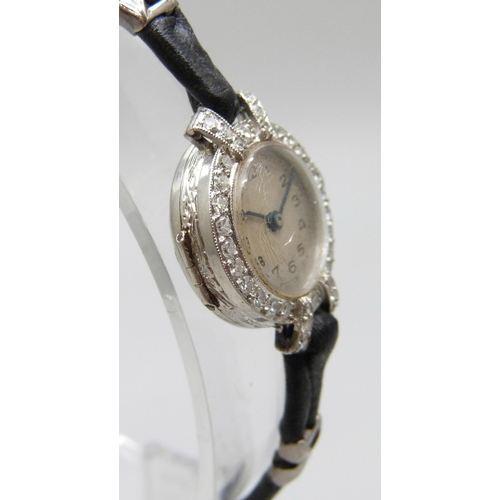 7189 - A lady's platinum and diamond cocktail wristwatch, 19mm including crown