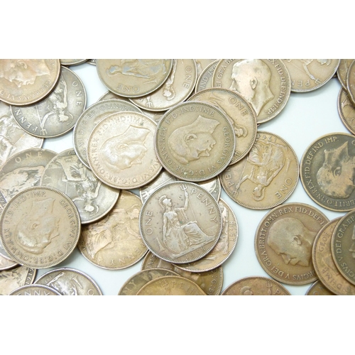 7210 - A collection of approximately 100 George VI pennies together with approximately 50 George V pennies