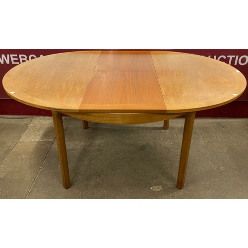 47 - A Nathan teak circular extending dining table