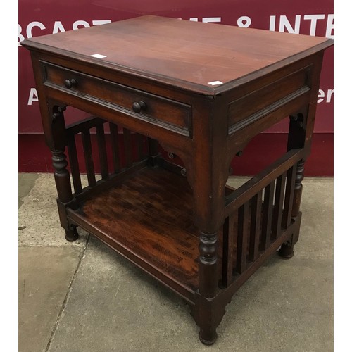 198 - An Arts and Crafts walnut two tier single drawer lamp table