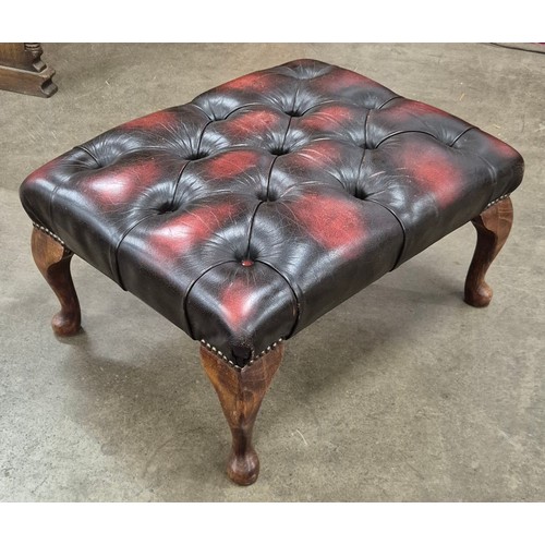 205 - An oxblood red leather Chesterfield footstool