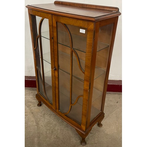 216 - An early 20th Century walnut display cabinet