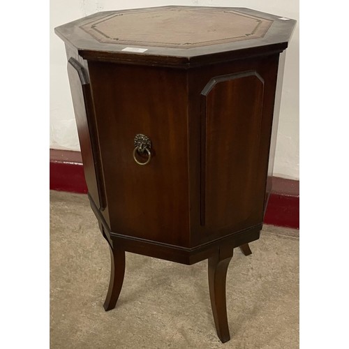 218 - A Regency style mahogany and leather topped octagonal cocktail cabinet