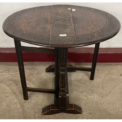 220 - A small 17th Century style carved oak gateleg table