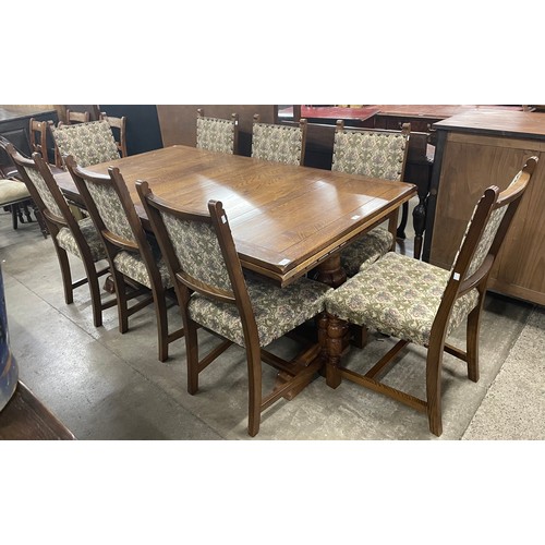 228 - A 17th Century style oak extending refectory table and six chairs