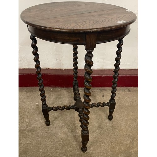 233 - An early 20th Century oak barley twist circular occasional table