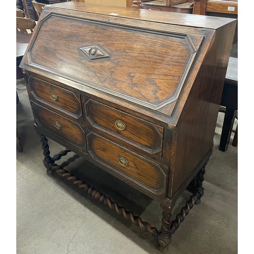 235 - An early 20th Century oak barleytwist bureau