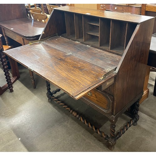 235 - An early 20th Century oak barleytwist bureau