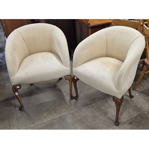 331 - A pair of early 20th Century Queen Anne walnut and beige fabric upholstered tub chairs