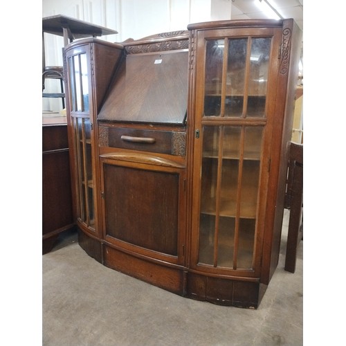 305 - An early 20th Century oak side by side bureau bookcase