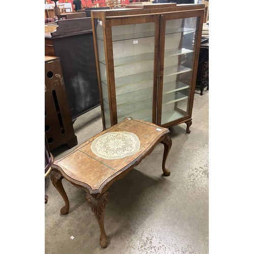 324 - An Art Deco walnut display cabinet and a mahogany and glass topped coffee table