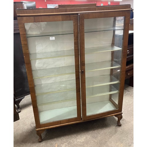 324 - An Art Deco walnut display cabinet and a mahogany and glass topped coffee table