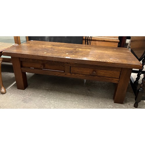328 - An oak two drawer coffee table