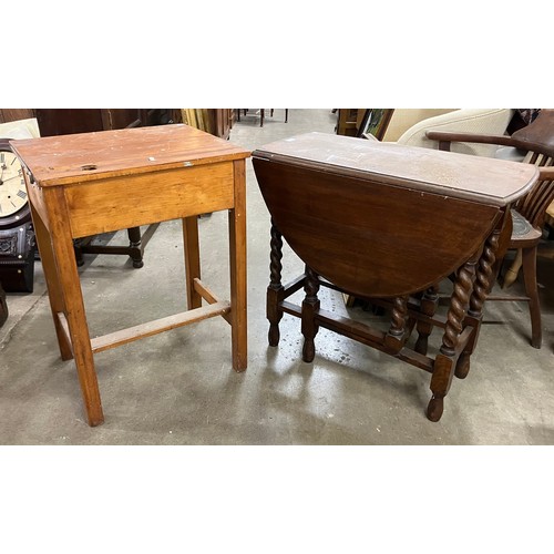 333 - A pine school desk and an oak barleytwist gateleg table