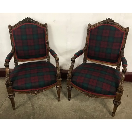 186 - A pair of 19th Century French carved oak and fabric upholstered fauteuil chairs