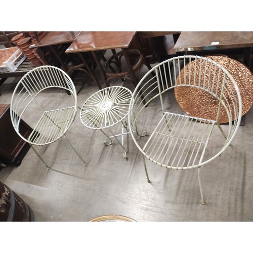356 - A pair of metal garden ball chairs and a table