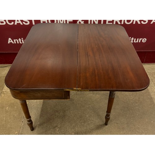 197 - A George IV inlaid mahogany foldover card table