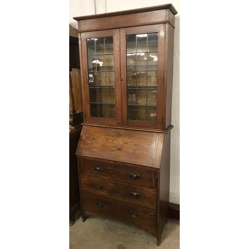 206 - An early 20th Century oak bureau bookcase